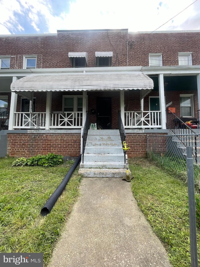 1618 Fort Dupont St SE, Washington, DC 20020 - view of property with brick siding and covered porch