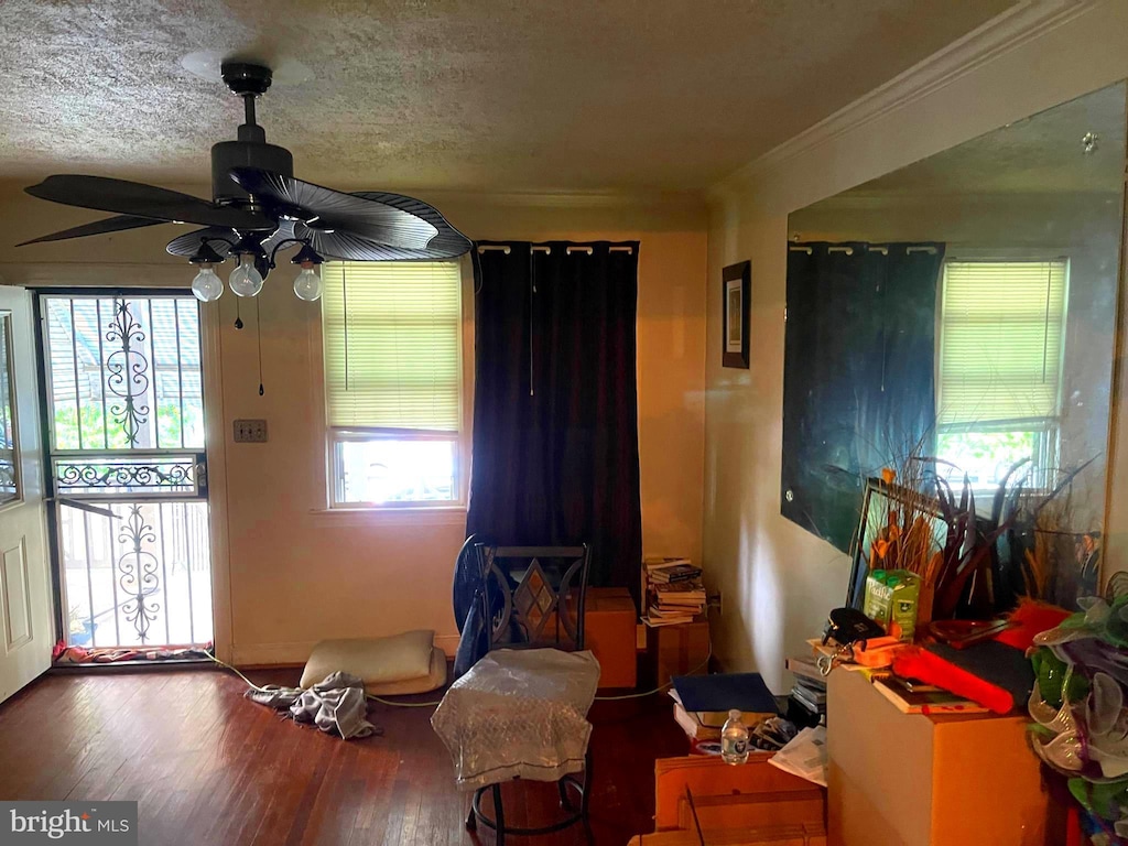 1618 Fort Dupont St SE, Washington, DC 20020 - living area featuring a ceiling fan, wood finished floors, and ornamental molding