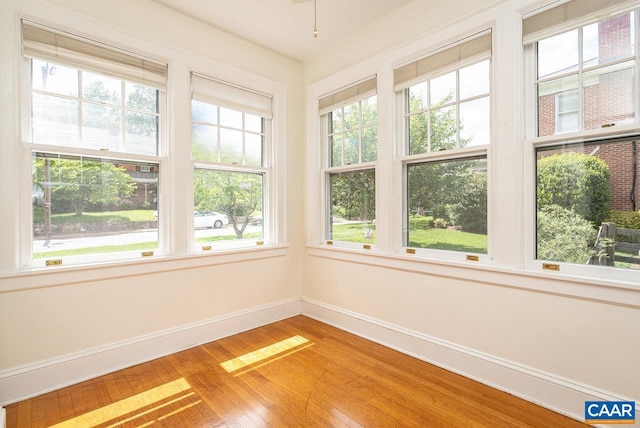 803 Alleghany Ave, Staunton, VA 24401 - unfurnished sunroom with plenty of natural light, baseboards, and wood finished floors
