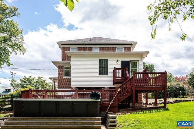 803 Alleghany Ave, Staunton, VA 24401 - back of property with a hot tub, a deck, stairs, brick siding, and a lawn