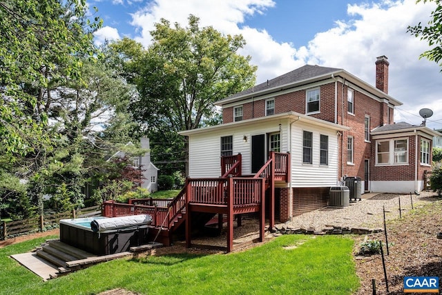 803 Alleghany Ave, Staunton, VA 24401 - rear view of house with a hot tub, a chimney, brick siding, a deck, and central AC unit