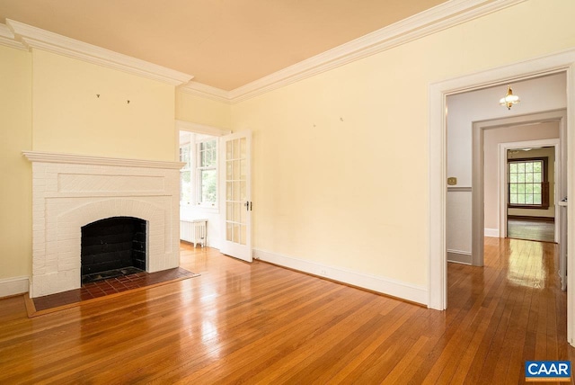 803 Alleghany Ave, Staunton, VA 24401 - unfurnished living room with radiator, baseboards, wood-type flooring, and ornamental molding