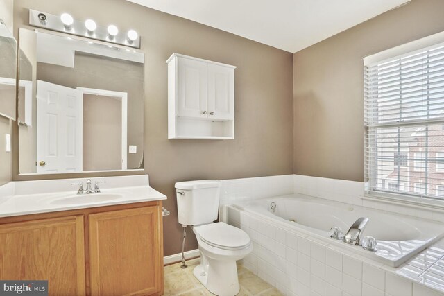 20866 Rockingham Ter, Sterling, VA 20165 - bathroom featuring a bath, toilet, vanity, and healthy amount of natural light