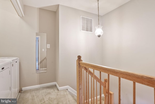 20866 Rockingham Ter, Sterling, VA 20165 - laundry room with washing machine and dryer, baseboards, and light carpet