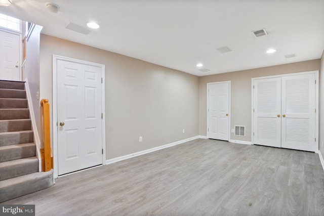 20866 Rockingham Ter, Sterling, VA 20165 - basement with light wood-type flooring, stairway, baseboards, and recessed lighting