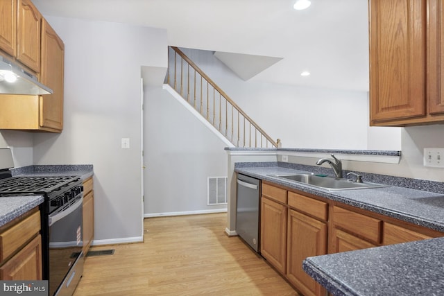 20866 Rockingham Ter, Sterling, VA 20165 - kitchen with black range with gas cooktop, dishwasher, under cabinet range hood, a sink, and dark countertops