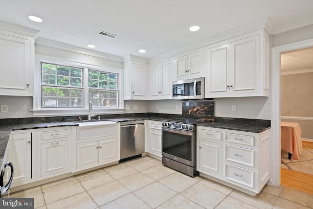 4 Old Elm Ct, Lutherville Timonium, MD 21093 - kitchen with appliances with stainless steel finishes, a sink, crown molding, white cabinets, and light tile patterned floors