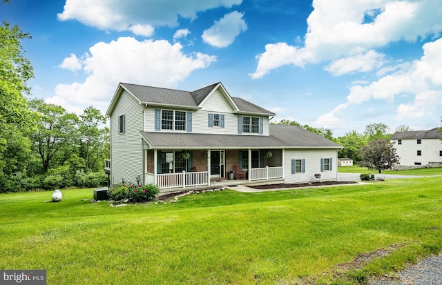 174 Greentree Dr, Bangor, PA 18013 - view of front of home with covered porch, a front yard, central air condition unit, and brick siding