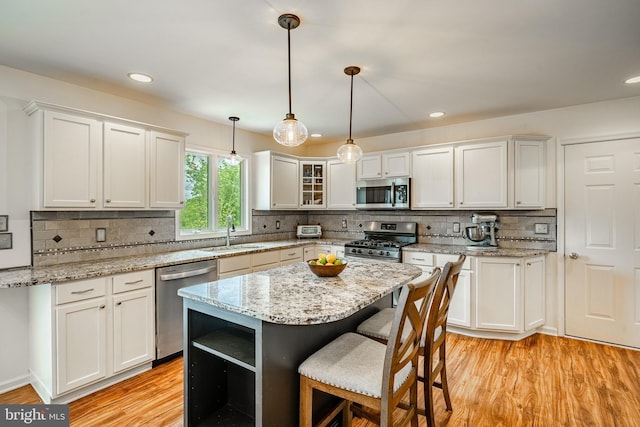 174 Greentree Dr, Bangor, PA 18013 - kitchen featuring stainless steel appliances, a sink, white cabinets, light wood finished floors, and recessed lighting