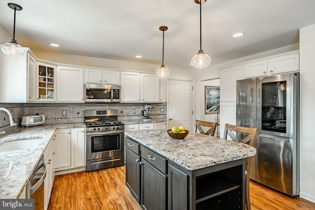 174 Greentree Dr, Bangor, PA 18013 - kitchen featuring stainless steel appliances, a sink, white cabinets, light wood finished floors, and recessed lighting