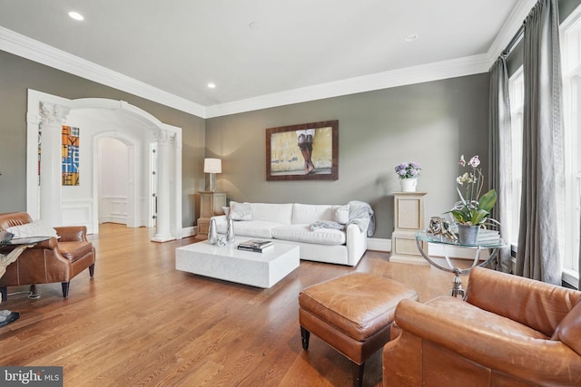 2555 Vale Ridge Ct, Oakton, VA 22124 - living room with crown molding, arched walkways, ornate columns, light wood-type flooring, and recessed lighting