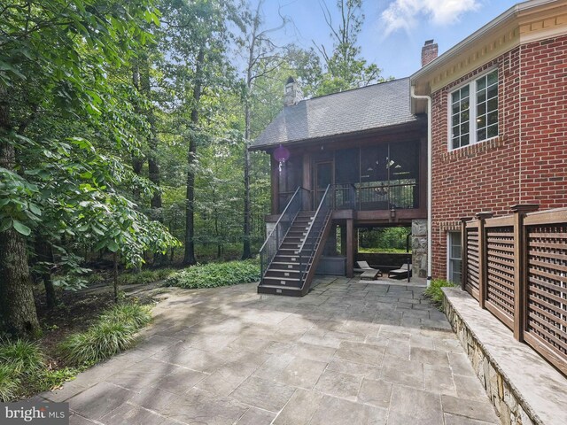 2555 Vale Ridge Ct, Oakton, VA 22124 - view of patio / terrace with a sunroom and stairway