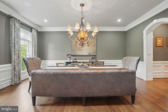 2555 Vale Ridge Ct, Oakton, VA 22124 - dining area featuring arched walkways, ornamental molding, a decorative wall, a wainscoted wall, and wood finished floors