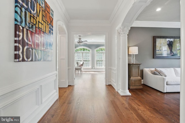 2555 Vale Ridge Ct, Oakton, VA 22124 - hallway with ornate columns, a decorative wall, crown molding, arched walkways, and wood finished floors