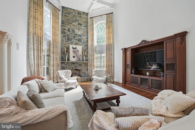 2555 Vale Ridge Ct, Oakton, VA 22124 - living area featuring ornamental molding, wood finished floors, a fireplace, and a towering ceiling
