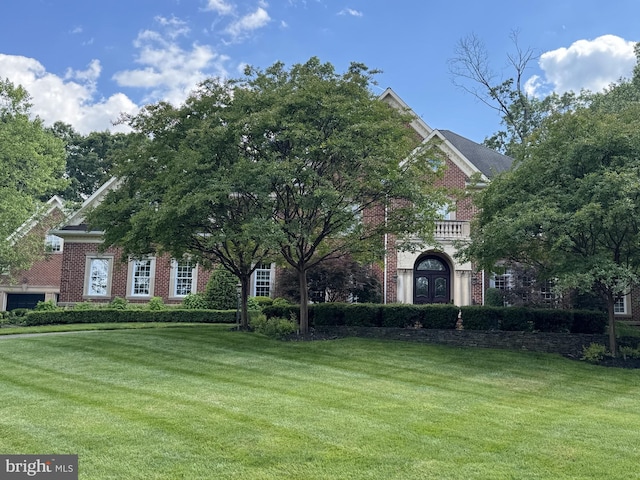 2555 Vale Ridge Ct, Oakton, VA 22124 - georgian-style home with a front yard and brick siding