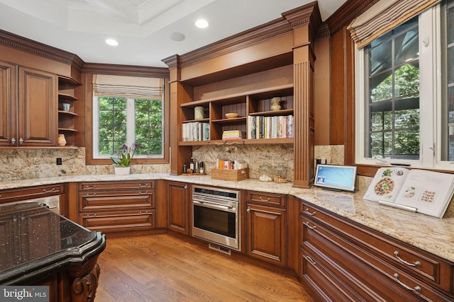 2555 Vale Ridge Ct, Oakton, VA 22124 - kitchen with open shelves, stainless steel oven, crown molding, light wood finished floors, and tasteful backsplash