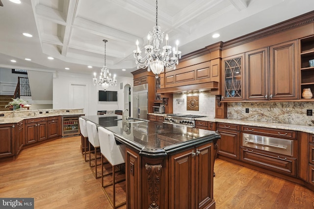 2555 Vale Ridge Ct, Oakton, VA 22124 - kitchen featuring a chandelier, a warming drawer, wine cooler, a large island, and stainless steel appliances