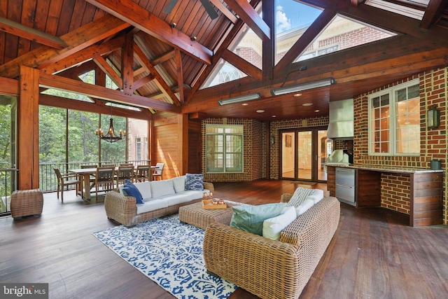 2555 Vale Ridge Ct, Oakton, VA 22124 - living room with a chandelier, hardwood / wood-style flooring, beam ceiling, and high vaulted ceiling