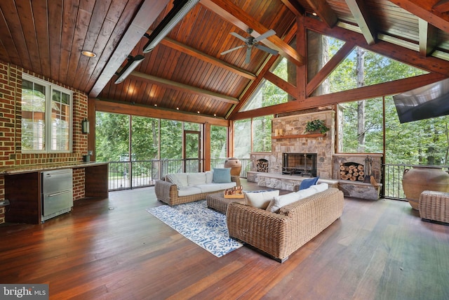 2555 Vale Ridge Ct, Oakton, VA 22124 - living area featuring ceiling fan, a fireplace, wood ceiling with exposed beams, wood finished floors, and high vaulted ceiling