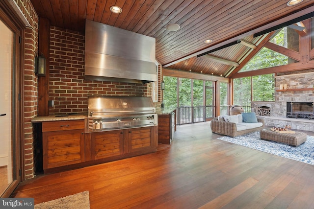 2555 Vale Ridge Ct, Oakton, VA 22124 - living room with wood finished floors, wood ceiling, a fireplace, recessed lighting, and expansive windows