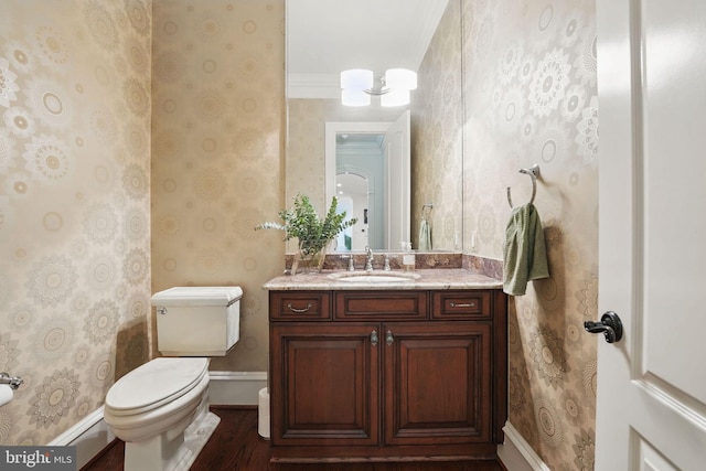 2555 Vale Ridge Ct, Oakton, VA 22124 - bathroom featuring wood finished floors, toilet, vanity, wallpapered walls, and baseboard heating