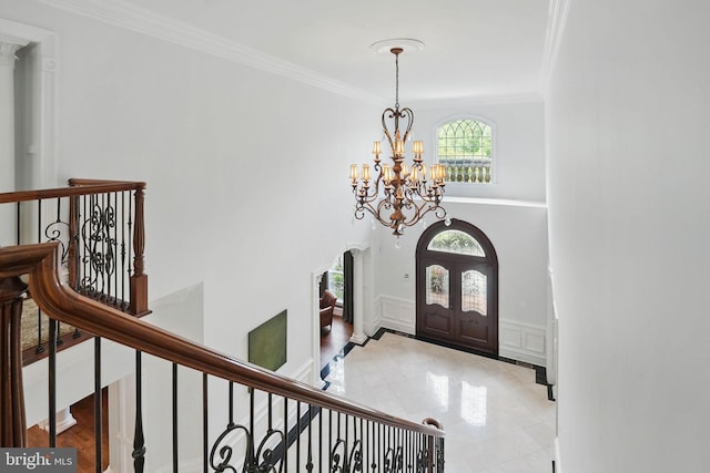 2555 Vale Ridge Ct, Oakton, VA 22124 - entryway with a chandelier, ornamental molding, arched walkways, french doors, and a decorative wall