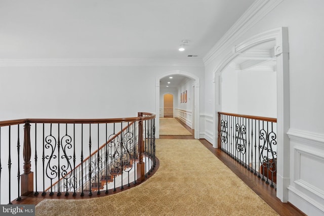 2555 Vale Ridge Ct, Oakton, VA 22124 - hall with wood finished floors, arched walkways, recessed lighting, crown molding, and a wainscoted wall