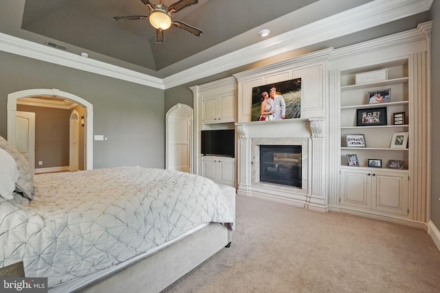 2555 Vale Ridge Ct, Oakton, VA 22124 - bedroom with light carpet, ornamental molding, arched walkways, a tray ceiling, and a high end fireplace