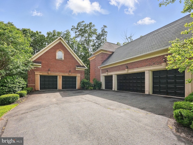 2555 Vale Ridge Ct, Oakton, VA 22124 - view of side of property with brick siding and asphalt driveway