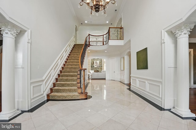 2555 Vale Ridge Ct, Oakton, VA 22124 - entrance foyer with a towering ceiling, a decorative wall, decorative columns, stairs, and crown molding