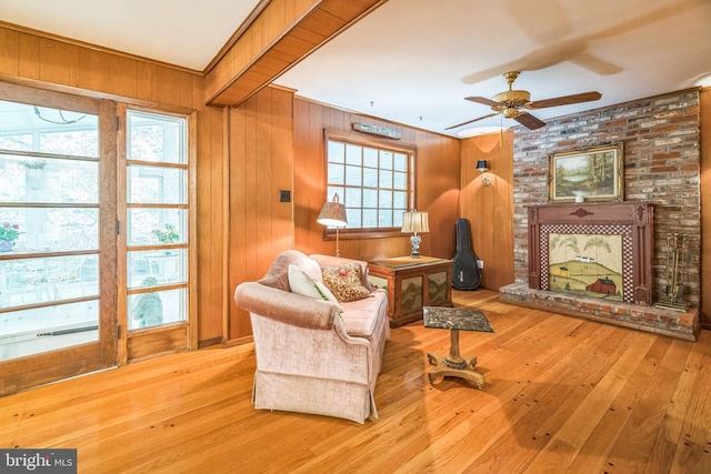 355 Arden, Gulph Mills, PA 19428 - living area with ceiling fan, hardwood / wood-style floors, wood walls, and ornamental molding