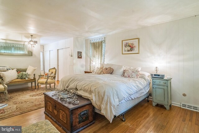 355 Arden, Gulph Mills, PA 19428 - bedroom featuring hardwood / wood-style flooring and a chandelier