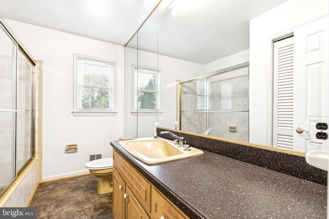 9511 Park St, Manassas, VA 20110 - bathroom with toilet, vanity, and baseboards