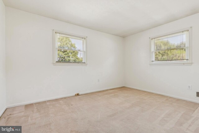 9511 Park St, Manassas, VA 20110 - spare room featuring light colored carpet and baseboards