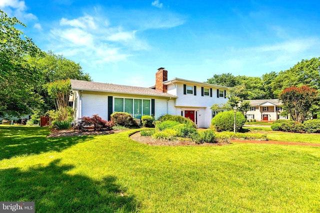 9511 Park St, Manassas, VA 20110 - rear view of property with a chimney and a yard