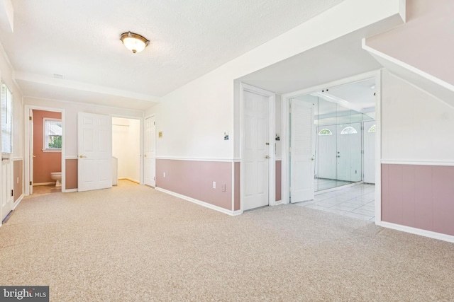9511 Park St, Manassas, VA 20110 - carpeted empty room featuring a textured ceiling and baseboards