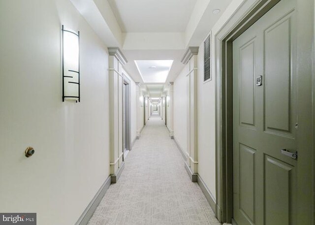 777 7th St NW Unit 913, Washington, DC 20001 - corridor featuring light carpet and baseboards