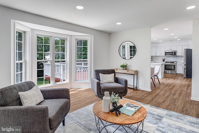 9509 Lincoln Ave, Manassas, VA 20110 - living room featuring light wood-type flooring, recessed lighting, and baseboards