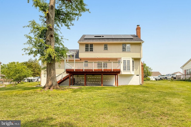 9509 Lincoln Ave, Manassas, VA 20110 - back of house with a wooden deck, solar panels, a chimney, and a yard