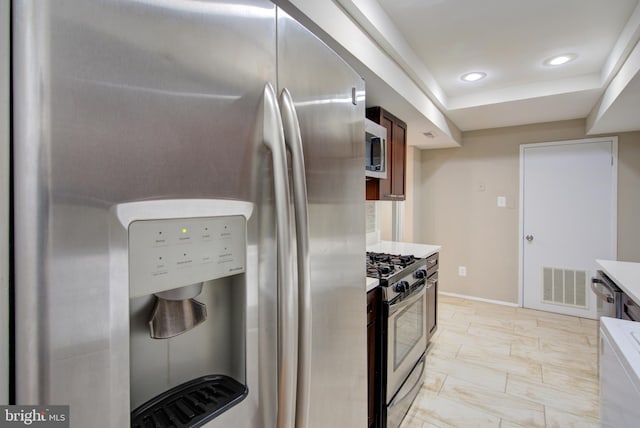 10249 Prince Pl Unit 31-203, Upper Marlboro, MD 20774 - kitchen with stainless steel appliances, light countertops, recessed lighting, baseboards, and light marble finish floors