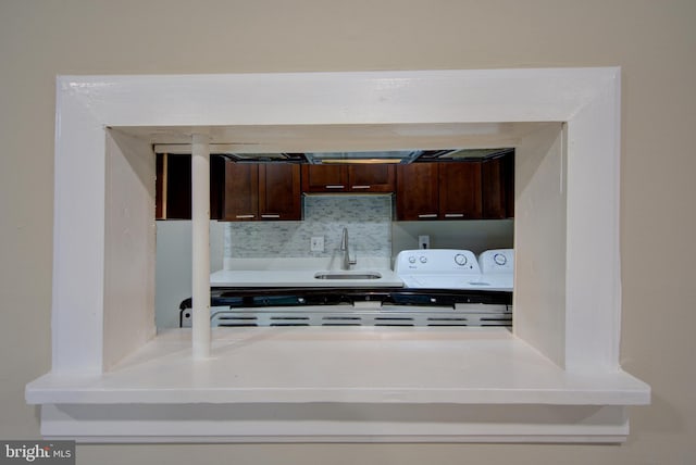 10249 Prince Pl Unit 31-203, Upper Marlboro, MD 20774 - kitchen with a sink, dark brown cabinetry, and light countertops