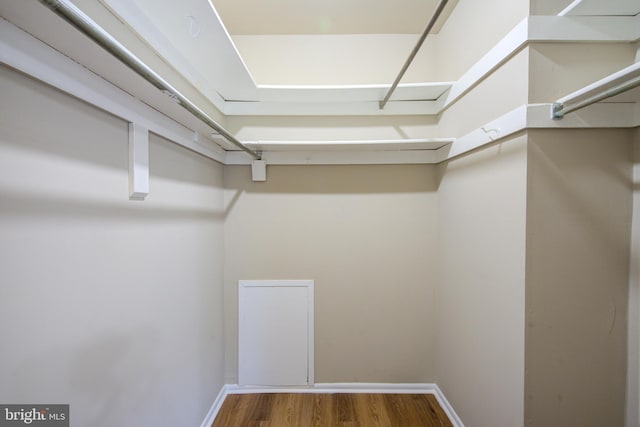 10249 Prince Pl Unit 31-203, Upper Marlboro, MD 20774 - walk in closet featuring wood finished floors