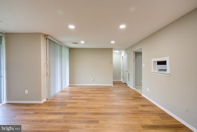 10249 Prince Pl Unit 31-203, Upper Marlboro, MD 20774 - spare room featuring recessed lighting, light wood-type flooring, and baseboards