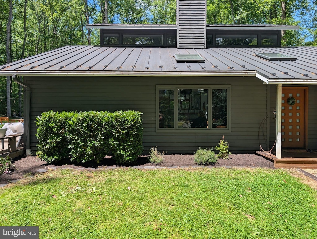 11902 Yates Ford Rd, Fairfax Station, VA 22039 - view of side of property featuring a standing seam roof, metal roof, and a lawn