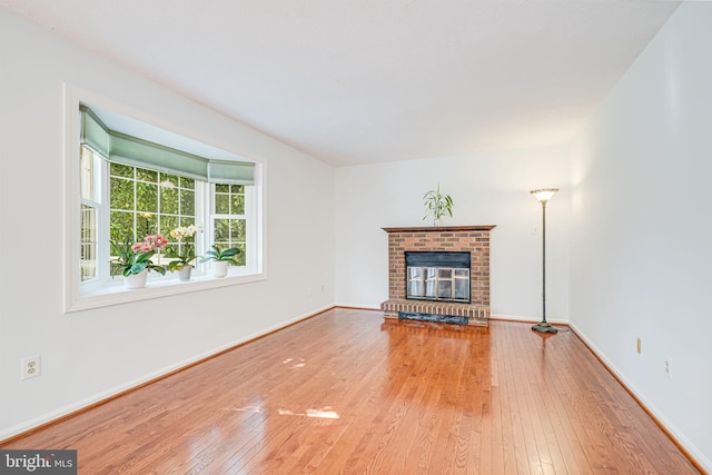 1434 Cellar Creek Way, Herndon, VA 20170 - unfurnished living room featuring wood-type flooring, a fireplace, and baseboards