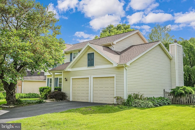1434 Cellar Creek Way, Herndon, VA 20170 - view of front of house featuring asphalt driveway, a garage, a shingled roof, and a chimney