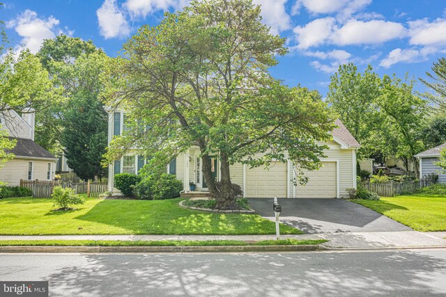 1434 Cellar Creek Way, Herndon, VA 20170 - view of property hidden behind natural elements with asphalt driveway and an attached garage