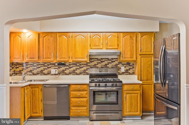 1518 Becklow Ave, Baltimore, MD 21220 - kitchen with appliances with stainless steel finishes, under cabinet range hood, a sink, and light countertops