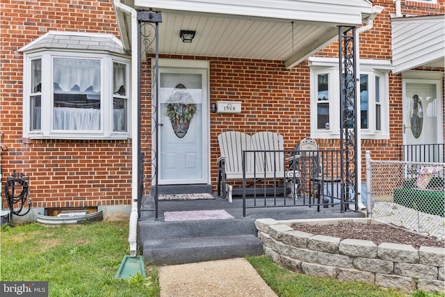 1518 Becklow Ave, Baltimore, MD 21220 - doorway to property with brick siding and a porch